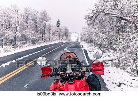 Touring motorcycle parked on roadside in winter, Placerville, California, USA View Large Photo Image Stock Photo - Touring motorcycle parked on roadside in winter, Placerville, California, USA. Fotosearch