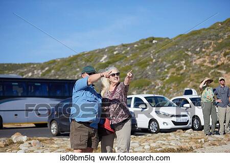 Tourists pointing into distance, Cape Town, Western Cape, South Africa View Large Photo Image Stock Photography - Tourists pointing into distance, Cape Town, Western Cape, South Africa. Fotosearch