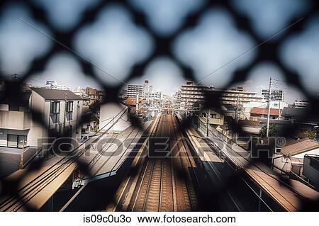 Train tracks seen through fencing, Tokushima-shi, Tokushima, Japan View Large Photo Image Picture - Train tracks seen through fencing, Tokushima-shi, Tokushima, Japan. Fotosearch