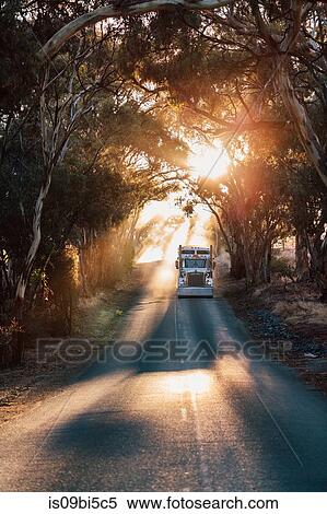 Stock Photography - Truck travelling on road, Sevenhill, Clare Valley, South Australia, Australia. Fotosearch