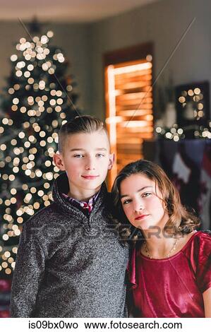 Picture - Twin brother and sister at Christmas. Fotosearch