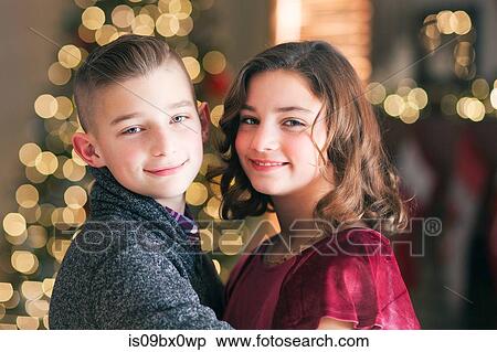 Stock Photography - Twin brother and sister at Christmas. Fotosearch
