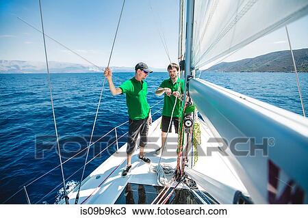 Two men yachting near coast, Croatia View Large Photo Image Stock Image - Two men yachting near coast, Croatia. Fotosearch