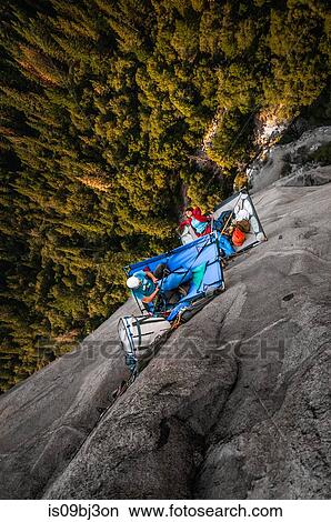 Two rock climbers on portaledges on triple direct, El Capitan, overhead view, Yosemite Valley, California, USA View Large Photo Image Picture - Two rock climbers on portaledges on triple direct, El Capitan, overhead view, Yosemite Valley, California, USA. Fotosearch