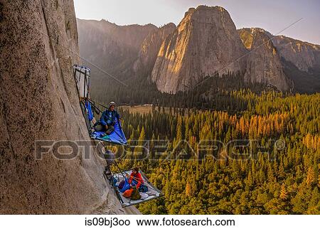 Picture - Two rock climbers on portaledges on triple direct, El Capitan, Yosemite Valley, California, USA. Fotosearch