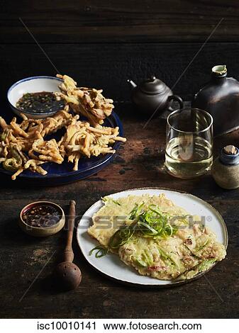 Stock Image - Vegetable twigim haemul pajueon, korean wine. Fotosearch