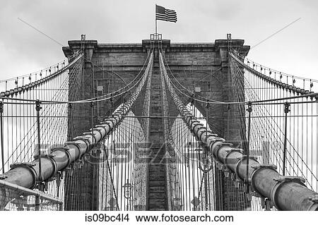 View of American flag on Brooklyn Bridge, B&W, New York, USA View Large Photo Image Picture - View of American flag on Brooklyn Bridge, B&W, New York, USA. Fotosearch