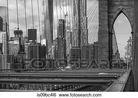Stock Photograph - View of Brooklyn Bridge and skyscrapers, B&W, New York, USA. Fotosearch