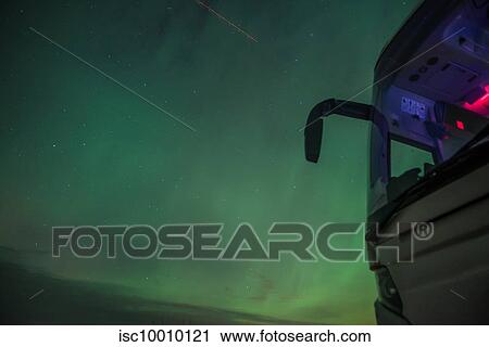 Stock Image - View of green aurora borealis sky at night, Vik, Iceland. Fotosearch