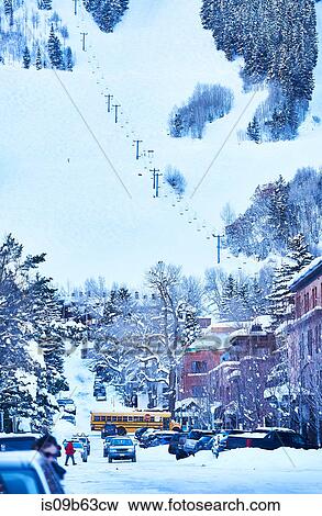 Stock Photo - View of snow covered town street and traffic, Aspen, Colorado, USA. Fotosearch