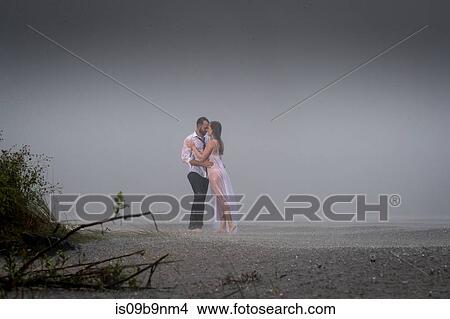 Wet couple on misty beach View Large Photo Image Picture - Wet couple on misty beach. Fotosearch