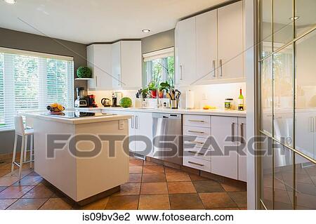 White cabinets, quartz countertop and island with glass hob and high back barstool in kitchen View Large Photo Image Stock Image - White cabinets, quartz countertop and island with glass hob and high back barstool in kitchen. Fotosearch