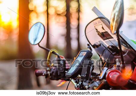 Windshield and controls of touring motorcycle at sunset, close up, Yosemite National Park, California, USA View Large Photo Image Stock Photo - Windshield and controls of touring motorcycle at sunset, close up, Yosemite National Park, California, USA. Fotosearch