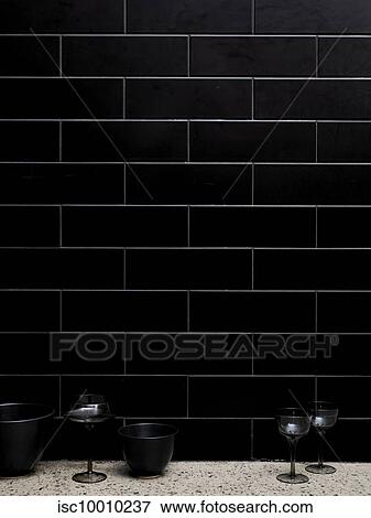 Wine glasses and bowls beside tiled wall View Large Photo Image Stock Photo - Wine glasses and bowls beside tiled wall. Fotosearch