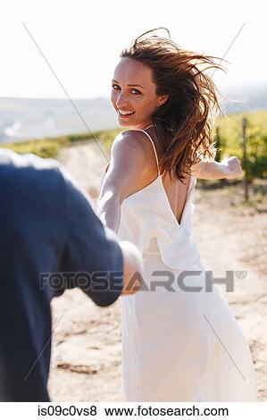 Woman and man walking in vineyards, Cape Town South Africa View Large Photo Image Stock Photo - Woman and man walking in vineyards, Cape Town South Africa. Fotosearch