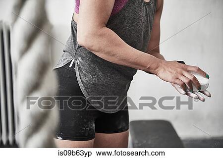 Stock Photography - Woman chalking hand. Fotosearch
