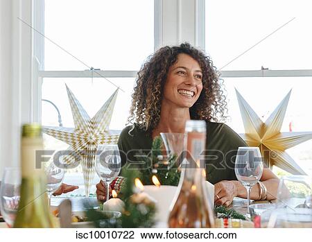 Woman dining at home party View Large Photo Image Stock Image - Woman dining at home party. Fotosearch