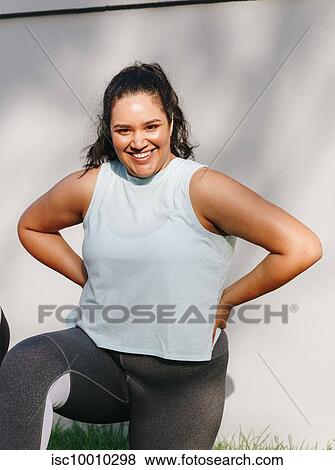 Woman doing stretching exercise in garden View Large Photo Image Stock Photo - Woman doing stretching exercise in garden. Fotosearch