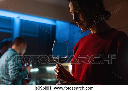 Woman drinking wine at party in apartment View Large Photo Image Stock Image - Woman drinking wine at party in apartment. Fotosearch