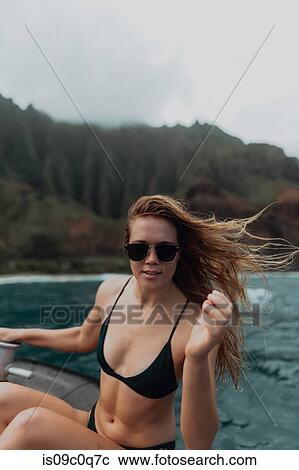 Woman enjoying boat ride, Princeville, Hawaii, US View Large Photo Image Stock Image - Woman enjoying boat ride, Princeville, Hawaii, US. Fotosearch