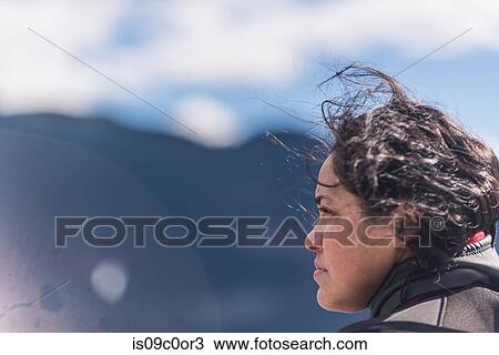 Woman enjoying breeze on sunny day View Large Photo Image Stock Image - Woman enjoying breeze on sunny day. Fotosearch
