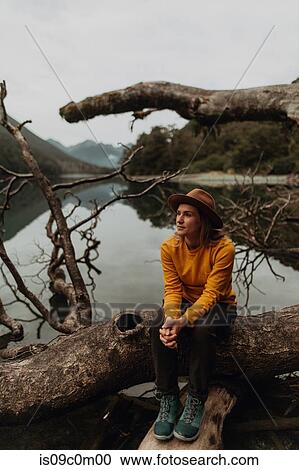 Stock Image - Woman enjoying scenic lake view, Queenstown, Canterbury, New Zealand. Fotosearch
