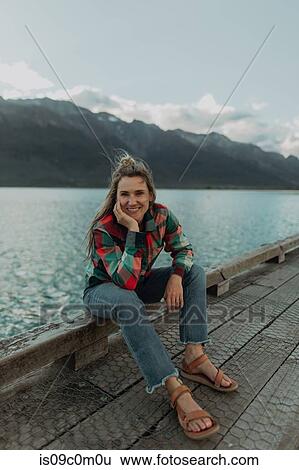 Woman enjoying scenic lake view, Queenstown, Canterbury, New Zealand View Large Photo Image Stock Photograph - Woman enjoying scenic lake view, Queenstown, Canterbury, New Zealand. Fotosearch