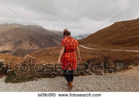 Stock Photography - Woman enjoying scenic landscape, Queenstown, Canterbury, New Zealand. Fotosearch