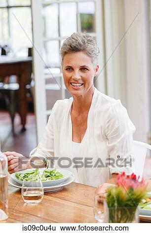 Woman having lunch in restaurant, Cape Town, South Africa View Large Photo Image Stock Photograph - Woman having lunch in restaurant, Cape Town, South Africa. Fotosearch
