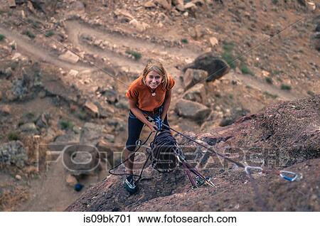 Woman holding climbing rope looking up smiling, Smith Rock State Park, Terrebonne, Oregon, United States View Large Photo Image Stock Image - Woman holding climbing rope looking up smiling, Smith Rock State Park, Terrebonne, Oregon, United States. Fotosearch
