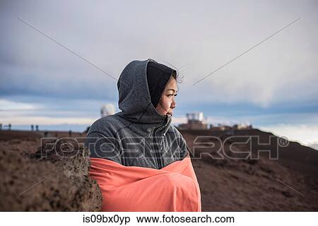 Woman hugging herself to warm up, Haleakala National Park, Maui, Hawaii View Large Photo Image Stock Photography - Woman hugging herself to warm up, Haleakala National Park, Maui, Hawaii. Fotosearch