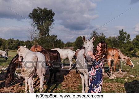 Woman hugging horse View Large Photo Image Stock Image - Woman hugging horse. Fotosearch