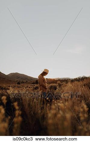 Woman in field landscape, Kennedy Meadows, California, US View Large Photo Image Stock Image - Woman in field landscape, Kennedy Meadows, California, US. Fotosearch