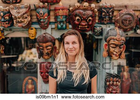 Woman in front of masks, Kathmandu, Nepal View Large Photo Image Stock Image - Woman in front of masks, Kathmandu, Nepal. Fotosearch