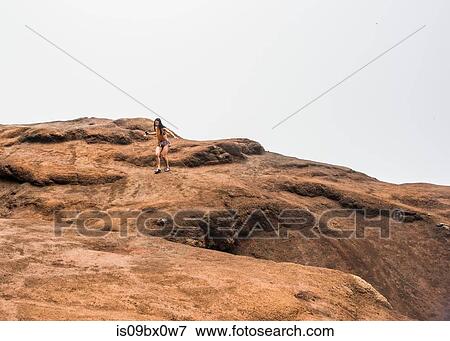 Stock Photo - Woman in hurry, Waimea Canyon, Kauai, Hawaii. Fotosearch