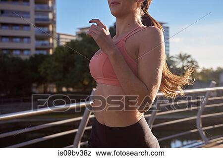 Woman jogging in city park, Barcelona, Catalonia, Spain View Large Photo Image Stock Photo - Woman jogging in city park, Barcelona, Catalonia, Spain. Fotosearch