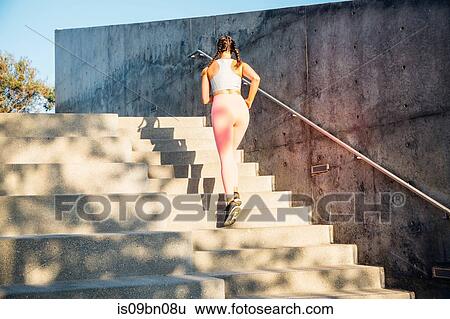 Woman jogging up steps View Large Photo Image Stock Photograph - Woman jogging up steps. Fotosearch