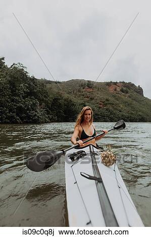 Woman kayaking, Princeville, Hawaii, US View Large Photo Image Stock Image - Woman kayaking, Princeville, Hawaii, US. Fotosearch