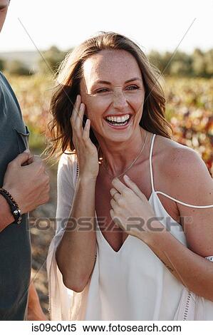 Woman laughing with her companion in vineyard, Cape Town, South Africa View Large Photo Image Stock Photography - Woman laughing with her companion in vineyard, Cape Town, South Africa. Fotosearch