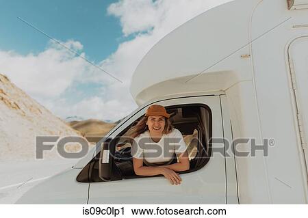 Woman leaning out window of motorhome View Large Photo Image Stock Image - Woman leaning out window of motorhome. Fotosearch