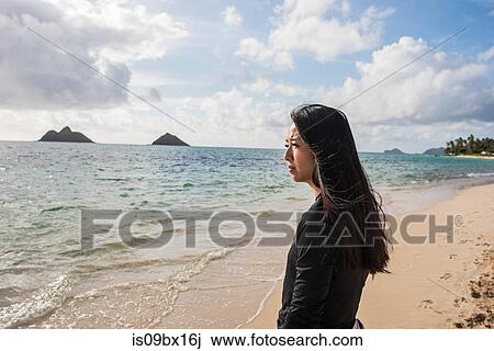 Woman looking out to sea, Lanikai Beach, Oahu, Hawaii View Large Photo Image Stock Image - Woman looking out to sea, Lanikai Beach, Oahu, Hawaii. Fotosearch