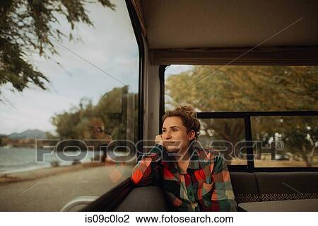 Woman looking out window of motorhome, Wanaka, Taranaki, New Zealand View Large Photo Image Stock Image - Woman looking out window of motorhome, Wanaka, Taranaki, New Zealand. Fotosearch