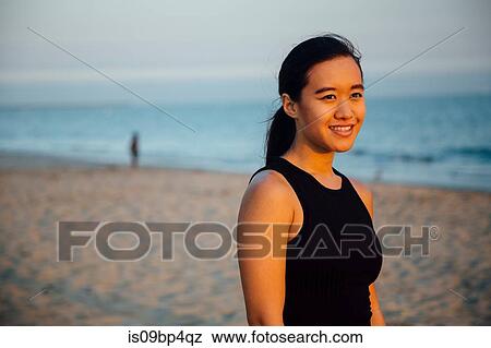 Stock Photo - Woman on beach. Fotosearch
