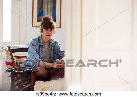 Woman on chair View Large Photo Image Stock Photo - Woman on chair. Fotosearch