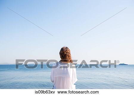 Woman on holiday by the seaside, Istanbul, Turkey, Asia View Large Photo Image Stock Photo - Woman on holiday by the seaside, Istanbul, Turkey, Asia. Fotosearch