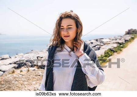 Woman on holiday by the seaside, Istanbul, Turkey, Asia View Large Photo Image Stock Photograph - Woman on holiday by the seaside, Istanbul, Turkey, Asia. Fotosearch