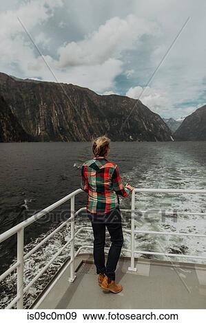 Woman on lake cruise, Queenstown, Canterbury, New Zealand View Large Photo Image Stock Photo - Woman on lake cruise, Queenstown, Canterbury, New Zealand. Fotosearch