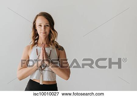 Woman practising yoga in studio View Large Photo Image Stock Photo - Woman practising yoga in studio. Fotosearch