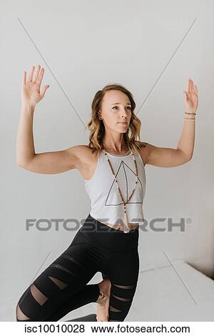 Woman practising yoga in studio View Large Photo Image Stock Photo - Woman practising yoga in studio. Fotosearch