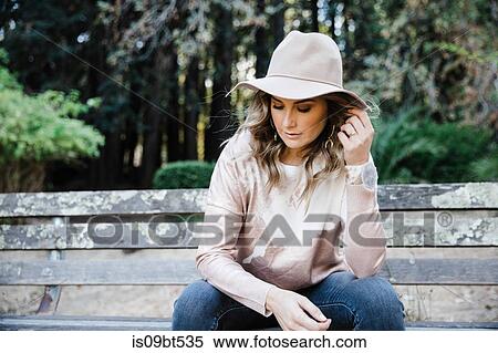 Woman relaxing on park bench, San Rafael, California, US View Large Photo Image Stock Photography - Woman relaxing on park bench, San Rafael, California, US. Fotosearch